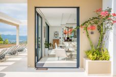 Interior of the Hilltop villa, with large windows to enjoy the views of Ibiza