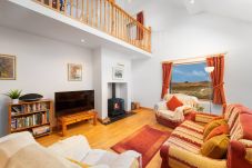 Lounge area at Cleggan Stone Cottage in Cleggan, County Galway, Connemara