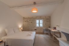 Spacious bedroom overlooking the courtyard garden