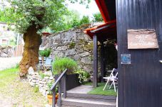 Entrance with garden and outdoor dining area