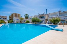 Apartment with communal pool near the beach.