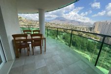 Large outdoor terrace with panoramic view of the Alicante mountains.