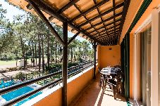 Balcony with table for meals.