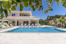 Luxury villa with pool and garden.