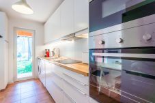 Fully equipped kitchen with natural light.