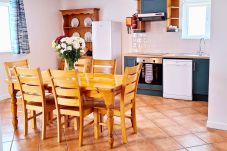 Dining Table and Kitchen at Dingle Harbour Cottages