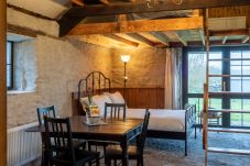 Master bedroom with Large window Ventry Farm Seaside Cottage 