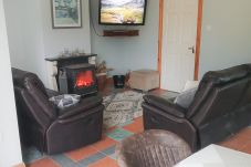 Cosy living room, open fire stove. Seamount Holiday Village No.26 , Seaside Holiday Home Available near Courtown Village, County Wexford